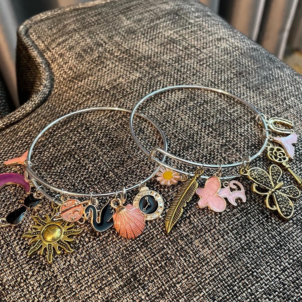2 custom silver charm bracelets. 8 charms on each